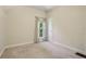Bedroom with neutral carpet, white walls, window, and trim at 351 Bannock St, Denver, CO 80223