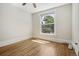 Sunny bedroom featuring hardwood floors, a ceiling fan, and large window with natural light at 351 Bannock St, Denver, CO 80223