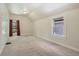 Bedroom with neutral carpet, white walls, window, and trim at 351 Bannock St, Denver, CO 80223