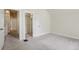 Bright, carpeted bedroom with white walls and a closet at 351 Bannock St, Denver, CO 80223