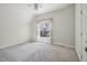 Neutral bedroom featuring a ceiling fan, window with sheer curtains, and carpet at 351 Bannock St, Denver, CO 80223