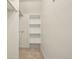 Well-organized closet featuring built-in shelving and a clothing rod for efficient storage solutions at 351 Bannock St, Denver, CO 80223