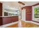 Cozy dining room featuring a red accent wall that opens to kitchen area at 351 Bannock St, Denver, CO 80223