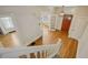 Inviting foyer with hardwood floors, white trim, and an open doorway to another room at 351 Bannock St, Denver, CO 80223