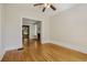 Bright living room with hardwood floors and classic trim, offering seamless flow to adjacent rooms at 351 Bannock St, Denver, CO 80223