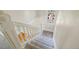 Bright staircase with carpeted steps and a white railing with a colored glass window at 351 Bannock St, Denver, CO 80223