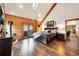 Cozy primary bedroom with wood accents, French doors to balcony, and a luxurious fireplace at 1055 Saddleback Dr, Evergreen, CO 80439
