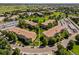 Aerial view of Windsor Gardens apartments in a maturely landscaped community with a golf course and lake at 610 S Alton Way # 7C, Denver, CO 80247