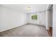 Cozy bedroom with neutral carpet, large window, and neutral walls at 610 S Alton Way # 7C, Denver, CO 80247