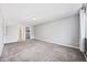 Bedroom features neutral carpet, a light, and a door to the bathroom at 610 S Alton Way # 7C, Denver, CO 80247
