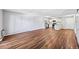 Open floorplan showcasing the living room and kitchen with beautiful hardwood flooring at 610 S Alton Way # 7C, Denver, CO 80247