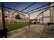 Inviting backyard boasts artificial turf, stone landscaping, a pergola, and a white picket fence for a charming touch at 2633 Garganey Dr, Castle Rock, CO 80104