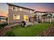 Spacious backyard with artificial turf, gravel landscaping, concrete patio, and a covered pergola at 2633 Garganey Dr, Castle Rock, CO 80104