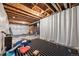 Partially finished basement with exposed wood ceiling, stripped carpet, and framed walls awaiting your vision at 2633 Garganey Dr, Castle Rock, CO 80104