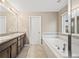 Bathroom with double sinks and a bathtub at 2633 Garganey Dr, Castle Rock, CO 80104