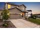 Traditional home with a two-car garage and nicely landscaped front yard at 2633 Garganey Dr, Castle Rock, CO 80104