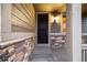 Close up of front door with stone accents and craftsman style at 2633 Garganey Dr, Castle Rock, CO 80104