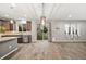 Bright kitchen with stainless steel appliances, granite countertops, and sliding glass doors to the backyard at 2633 Garganey Dr, Castle Rock, CO 80104