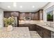 Modern kitchen featuring granite countertops, tile backsplash, and updated stainless steel appliances at 2633 Garganey Dr, Castle Rock, CO 80104