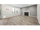 Spacious living room with fireplace, tile flooring, and natural light at 2633 Garganey Dr, Castle Rock, CO 80104