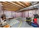 Unfinished basement featuring exposed beams, insulation, and ample storage space at 17464 Crestview Ct, Monument, CO 80132