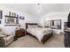 Bedroom with a bed, mirrored wall, nightstand, and seating area at 17464 Crestview Ct, Monument, CO 80132
