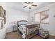 Comfortable bedroom with a cozy bed, soft carpet, and natural light at 17464 Crestview Ct, Monument, CO 80132
