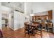 Open-concept dining area with great light, adjacent to the kitchen, and with staircase view at 17464 Crestview Ct, Monument, CO 80132
