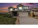 Inviting two-story home boasts a neutral color palette, a two-car garage, and a well-maintained front yard at 17464 Crestview Ct, Monument, CO 80132