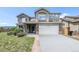 Attractive two-story home with neutral color palette, brick accents, two car garage and manicured front yard at 17464 Crestview Ct, Monument, CO 80132