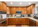 Bright kitchen with stainless steel appliances, light countertops, and plenty of storage at 17464 Crestview Ct, Monument, CO 80132