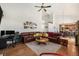 Spacious living room with a fireplace, comfortable seating, and view into the Kitchen area at 17464 Crestview Ct, Monument, CO 80132
