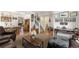 Open-concept living area with a staircase, wood floors, and a cozy seating arrangement at 17464 Crestview Ct, Monument, CO 80132