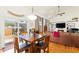 Inviting living room with hardwood floors, vaulted ceilings, and a cozy fireplace at 17464 Crestview Ct, Monument, CO 80132