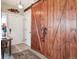 Welcoming foyer featuring a decorative sliding barn door and durable wood-look flooring at 7344 S Sheephorn Mtn, Littleton, CO 80127