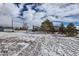 Wide backyard with partial snow cover highlighting property size and potential for landscaping at 1901 Blue Mountain Ave, Berthoud, CO 80513