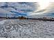 Spacious backyard with partial snow cover offering ample outdoor space and potential at 1901 Blue Mountain Ave, Berthoud, CO 80513