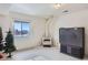 Cozy finished basement with a decorative stove, large window and a flat-screen TV at 1901 Blue Mountain Ave, Berthoud, CO 80513