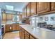 Bright kitchen with wood cabinets, stainless steel appliances, skylight, and a spacious island at 1901 Blue Mountain Ave, Berthoud, CO 80513