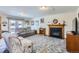 Inviting living room with a fireplace, comfortable seating, and a sliding door with backyard views at 1901 Blue Mountain Ave, Berthoud, CO 80513