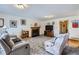 Spacious living room features a fireplace, comfortable seating, and ample natural light from a doorway at 1901 Blue Mountain Ave, Berthoud, CO 80513