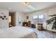 Spacious main bedroom featuring a skylight, a large window with views, and neutral décor at 1901 Blue Mountain Ave, Berthoud, CO 80513