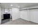 Bright basement bedroom with ensuite bathroom, closet, and carpet flooring offers functional living space at 1925 Syracuse St, Denver, CO 80220