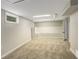 Spacious carpeted basement living area with bright recessed lighting, a window and built in seating at 1925 Syracuse St, Denver, CO 80220