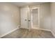 Bedroom featuring neutral walls, carpet and closet with double doors at 1925 Syracuse St, Denver, CO 80220