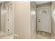 Hallway with LVP flooring and door with half-moon window at 1925 Syracuse St, Denver, CO 80220