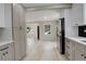 Kitchen with stainless steel appliances and light wood flooring, open to the living space at 1925 Syracuse St, Denver, CO 80220