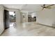 Living room with light wood flooring and an open doorway to the home's entrance at 1925 Syracuse St, Denver, CO 80220
