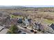 Aerial view of residential area with well-maintained homes, mature trees, and manicured landscaping at 9659 W Cornell Pl, Lakewood, CO 80227