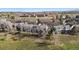 Serene townhomes offering picturesque views and blending seamlessly into the surrounding lush green landscape at 9659 W Cornell Pl, Lakewood, CO 80227